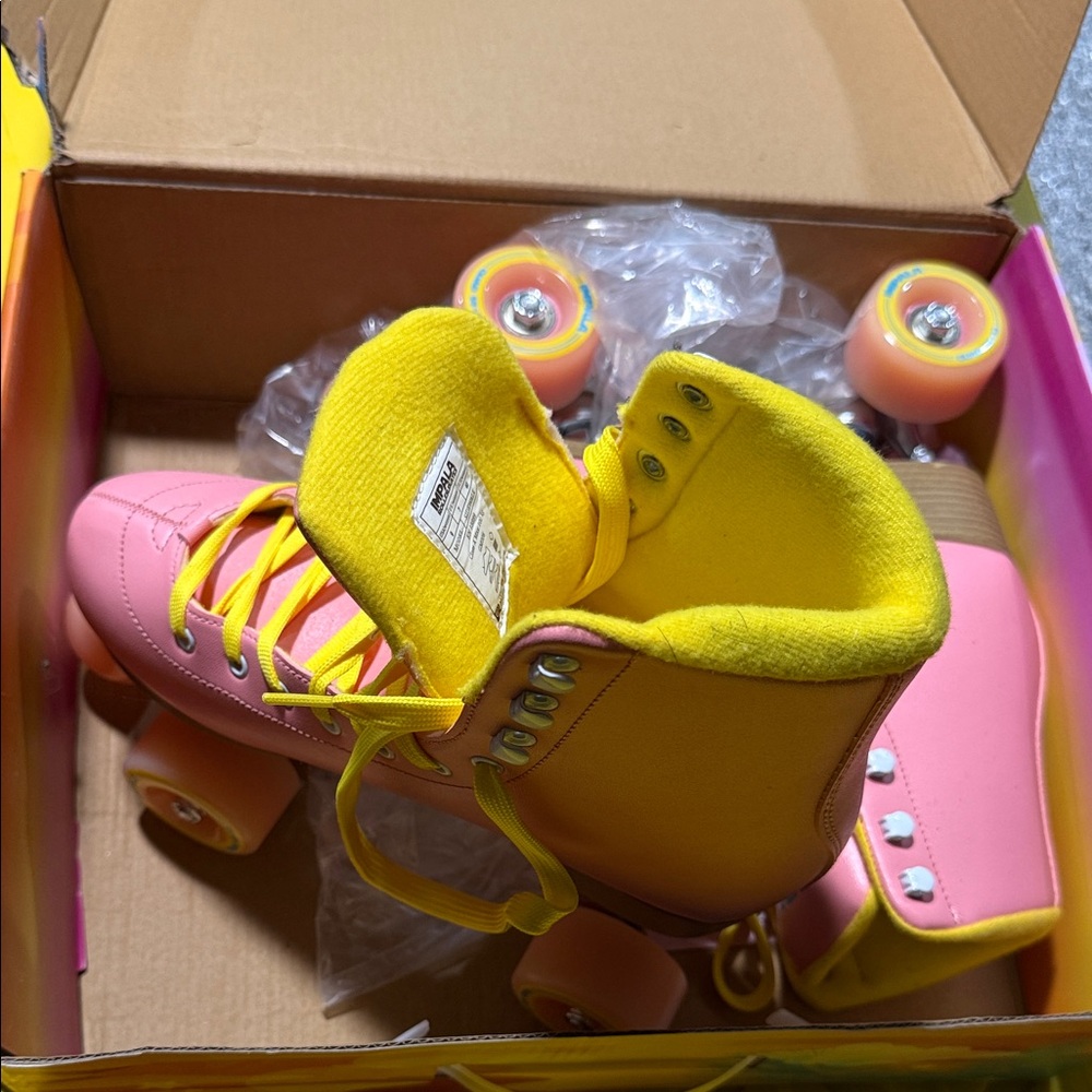 Brand new, never worn, Vibrant Pink and Yellow Roller Skates